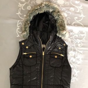 Black lightly puffy vest with hood with faux fur. Size Med, like new.